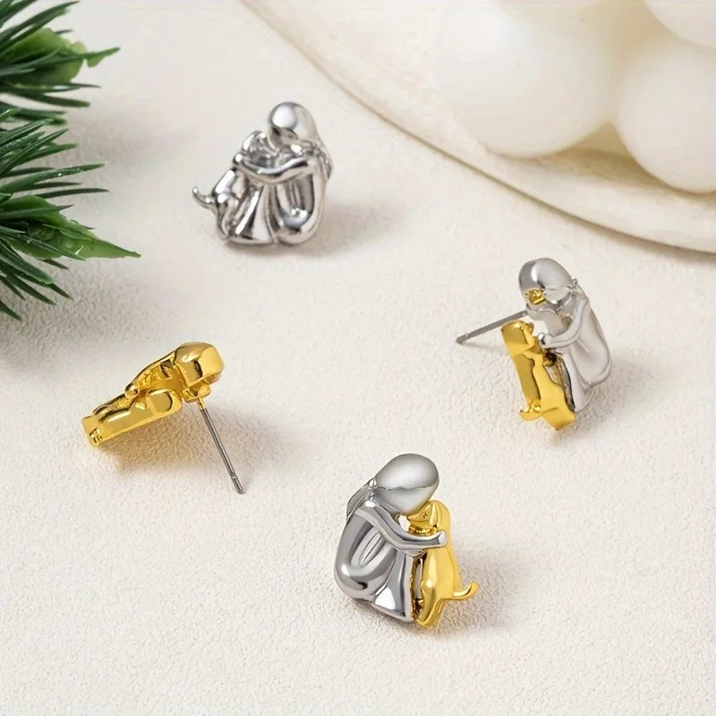 NURI – Elegante bicolor Bicolor-Umarmungs-Ohrstecker aus Silber & Gold für stilvollen Look