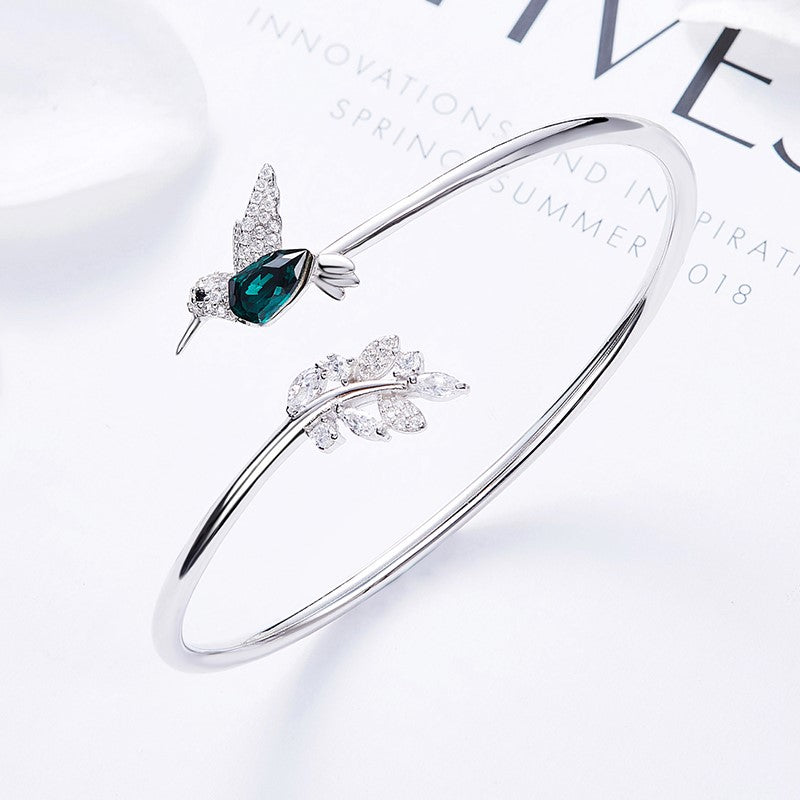 AYANA – Eleganter verstellbarer Kolibri-Ring mit funkelndem Strassdiamant