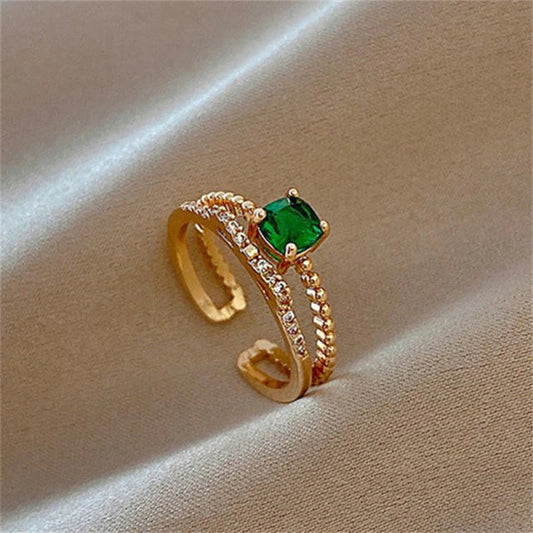 Verstellbarer Ring mit grünem Zirkon in Gold